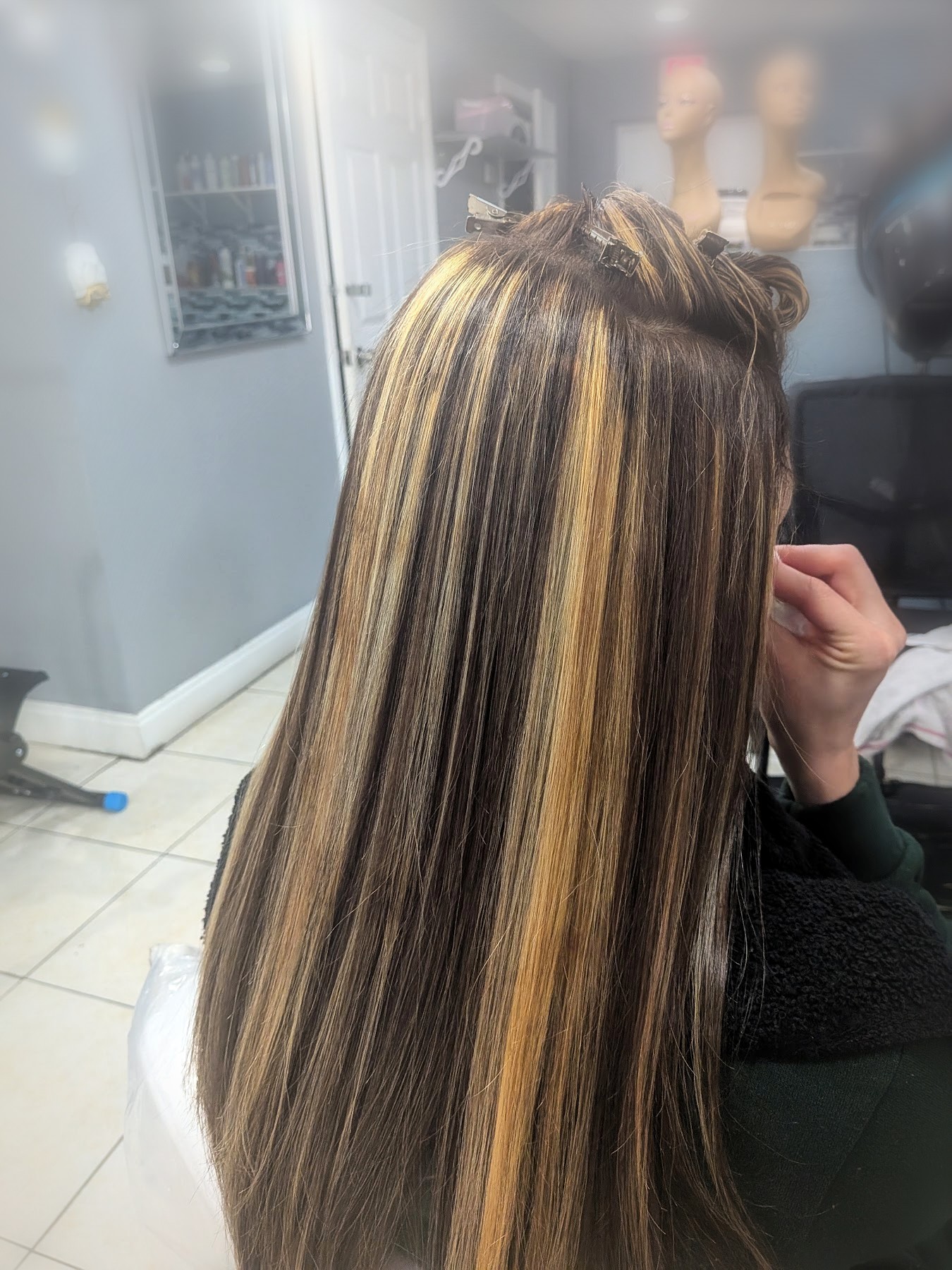 Blonde highlights on long straight hair by Johanny, Pompano Beach