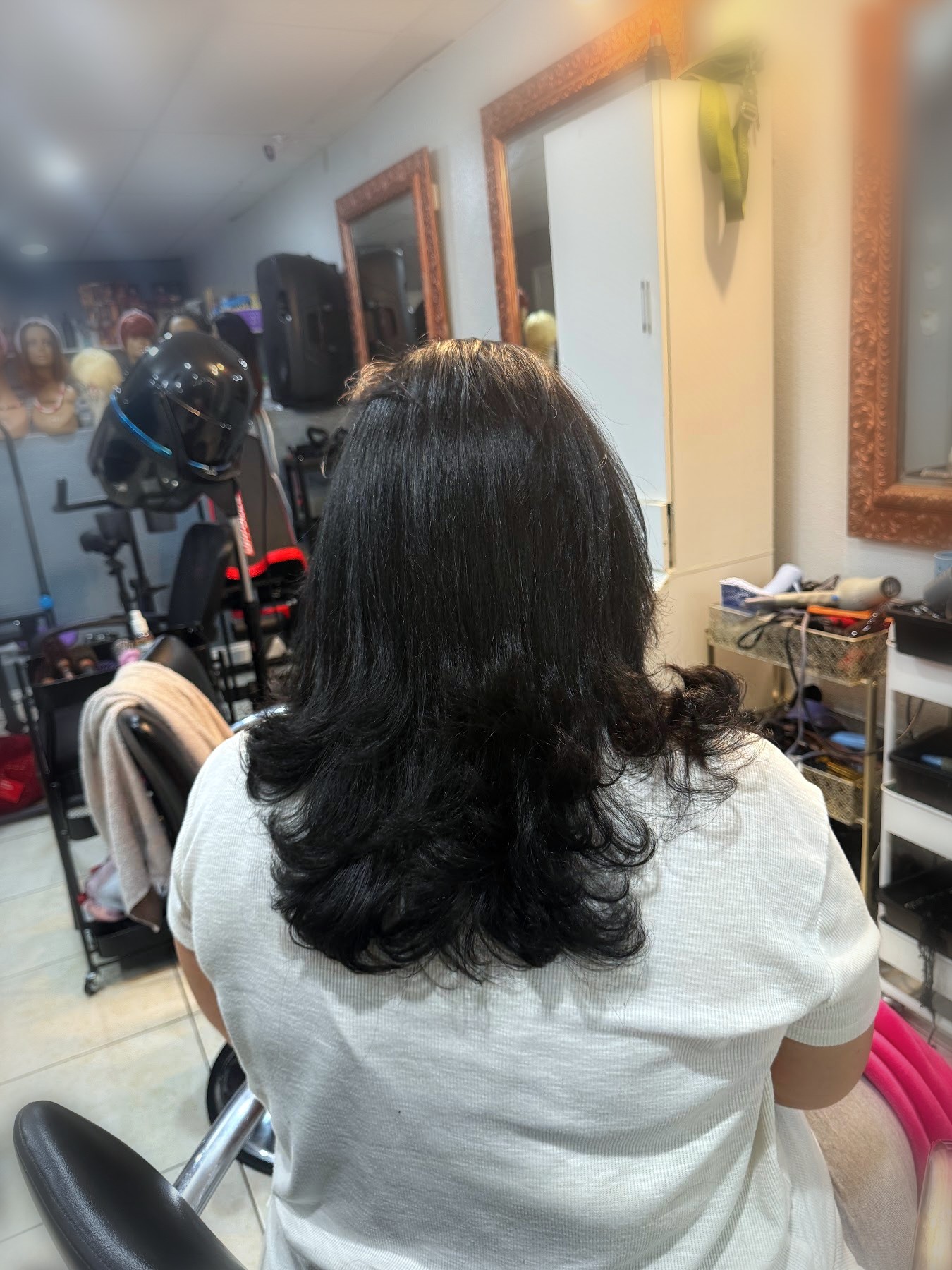 Voluminous black blowout with curled ends by Johanny, Pompano Beach