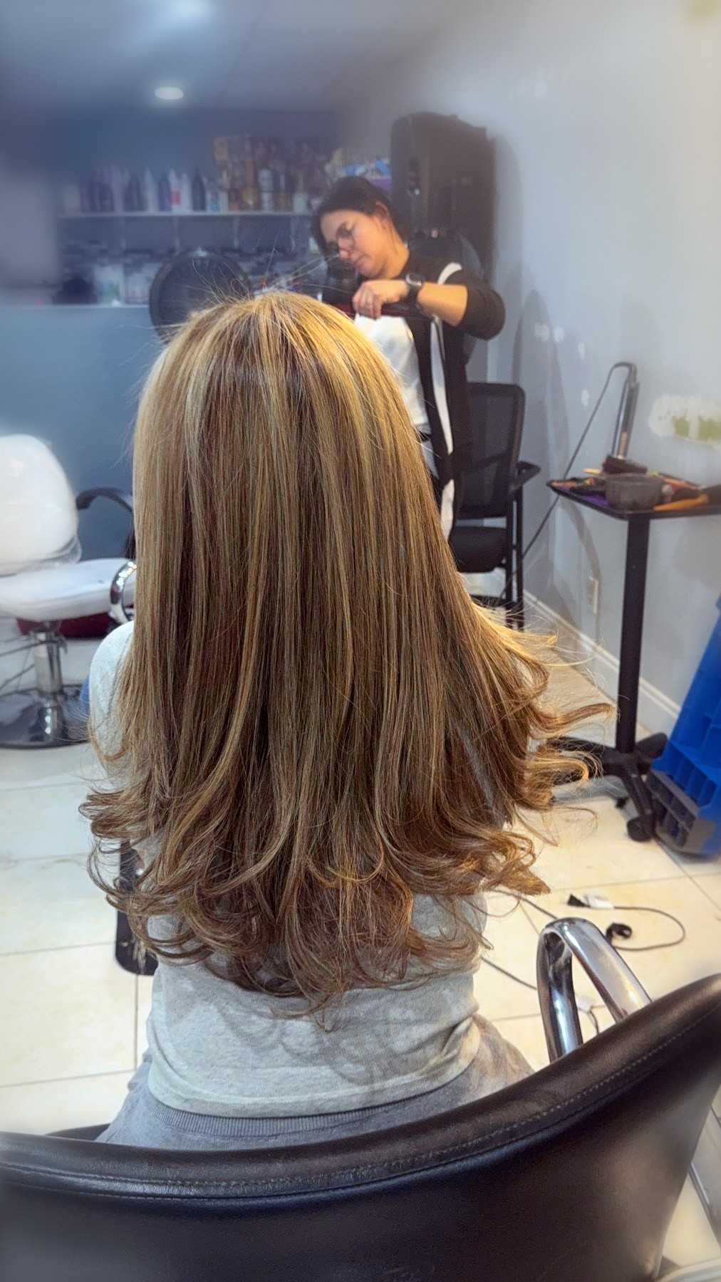 Honey blonde layered blowout with curls by Johanny, Pompano Beach
