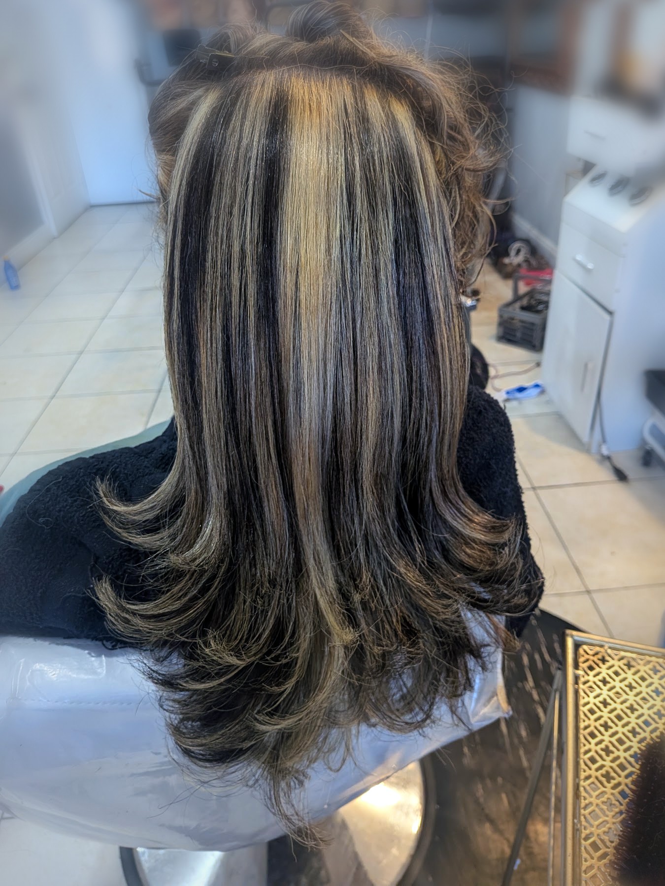 Bold blonde highlights with bouncy blowout by Johanny, Pompano Beach
