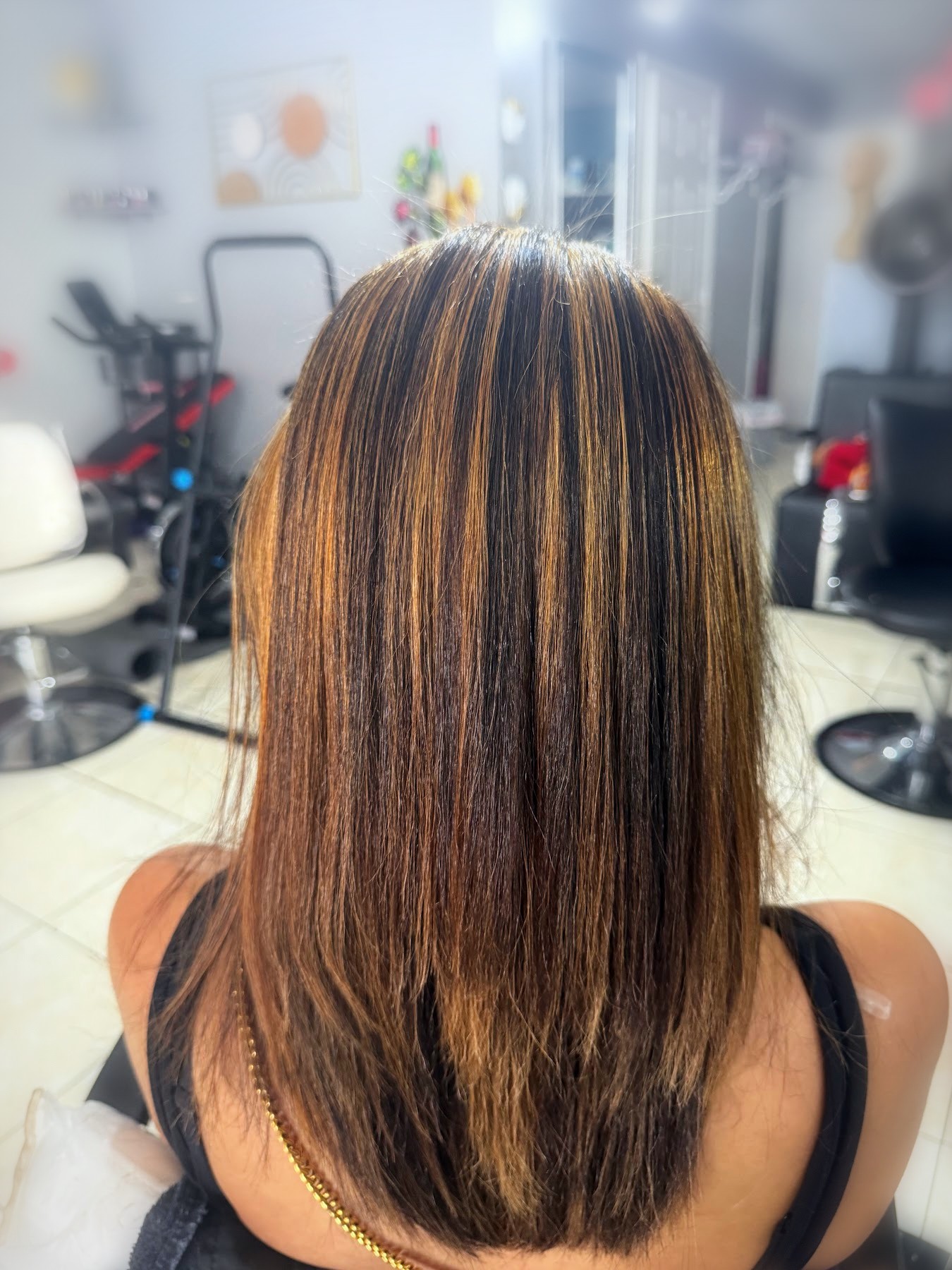 Caramel highlights with silk press finish by Johanny, Pompano Beach